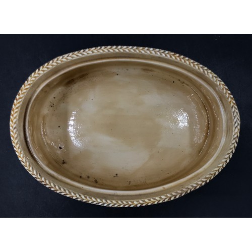 267 - A Wedgwood Majolica Game Pie Dish, with liner, oval, the cover with rabbit finial and moulded in rel... 