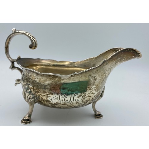 765 - A George III silver creamer, London 1764 maker William Skeen. Initials to one side. 132gm.