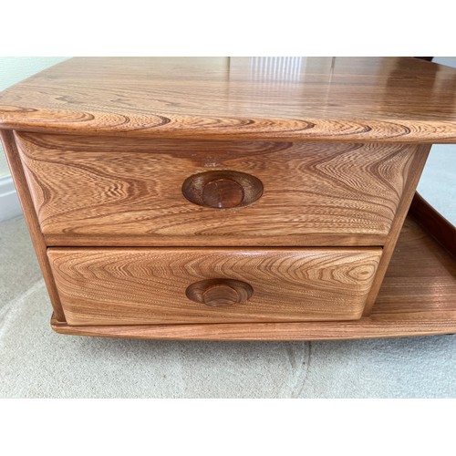 163 - An Ercol Pandora coffee table with two drawers to the side.