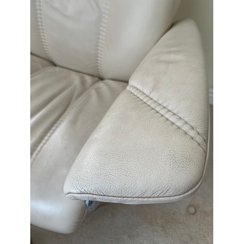 164 - Cream leather Stressless armchair and footstool.