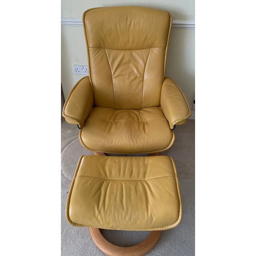 165 - Mustard coloured leather Stressless armchair and footstool.