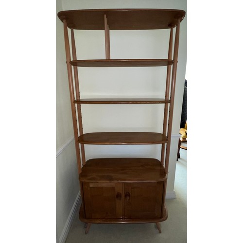 166 - An Ercol Giraffe room divider. 101cm h x81 w x 38 d.