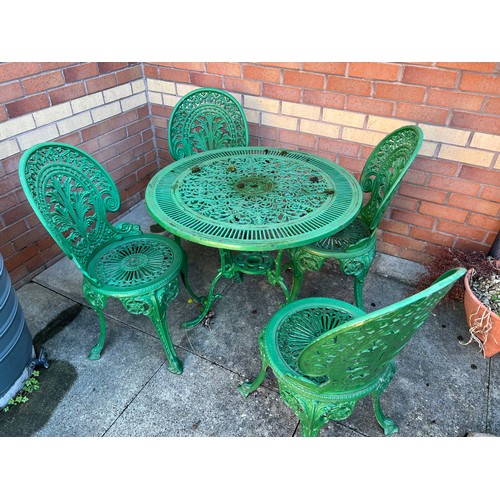 217 - Aluminium garden table and four chairs. 79cm d.