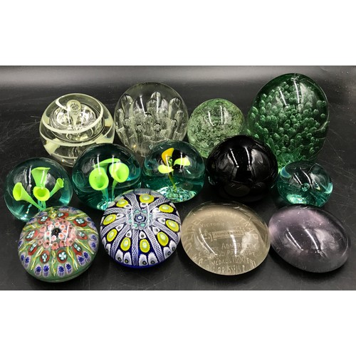 399 - A group of 13 paperweights, various colours and designs to include a Castleford dump and two millefi... 