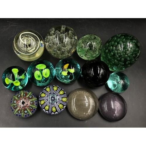 399 - A group of 13 paperweights, various colours and designs to include a Castleford dump and two millefi... 