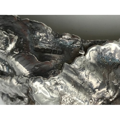 752 - A silver oyster shaped salt, London 1998 maker indistinct together with a silver salt spoon maker GL... 