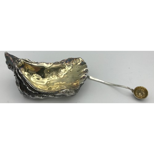 752 - A silver oyster shaped salt, London 1998 maker indistinct together with a silver salt spoon maker GL... 