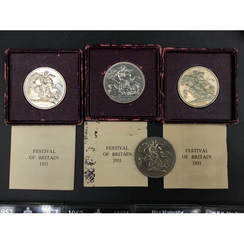 667 - A collection of coins to include three boxed 1951 festivals of Britan crown piece and one additional... 