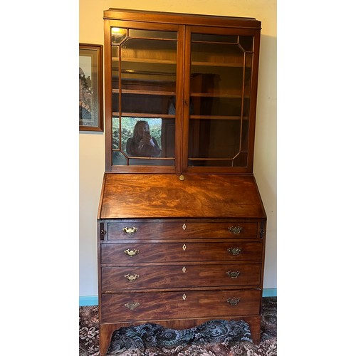 175 - A Georgian Mahogony bureau bookcase on bracket feet and fitted interior. A later two door bookcase t... 