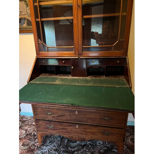 175 - A Georgian Mahogony bureau bookcase on bracket feet and fitted interior. A later two door bookcase t... 