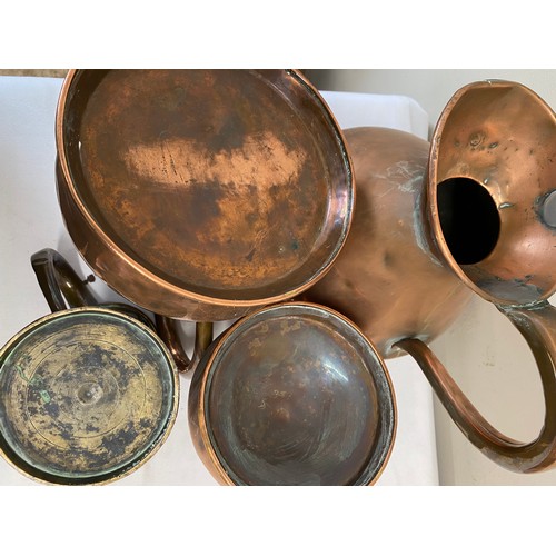 1059 - Three graduated copper measures together with a copper tankard. Largest jug 28cm h.