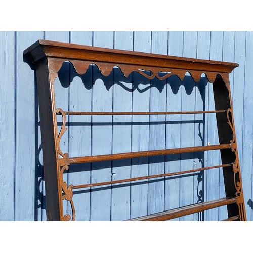 167 - An oak plate rack wall mounted 100 x 111cm.