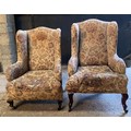 Two upholstered wing back chairs on cabriole legs and castors in need of restoration. Tallest to the... 