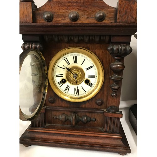 1177 - A vintage wooden cased H A C Wurttemberg 14 day strike mantel clock, 45cm h together with another wo... 