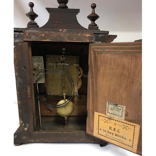 1177 - A vintage wooden cased H A C Wurttemberg 14 day strike mantel clock, 45cm h together with another wo... 