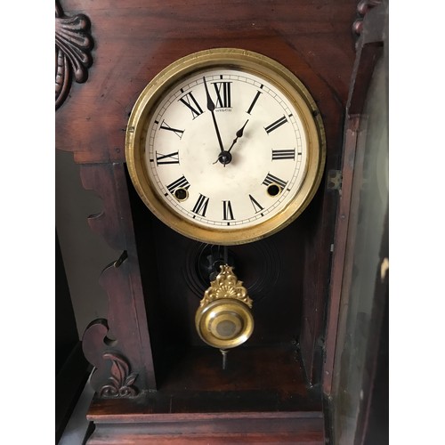 1178 - An American mahogany mantel clock with circular painted dial marked 'Welch' and Roman numerals above... 