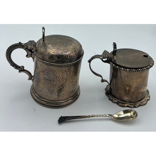 755 - Two silver mustard pots with blue glass liners and one mustard spoon. London 1857, maker William Rob... 