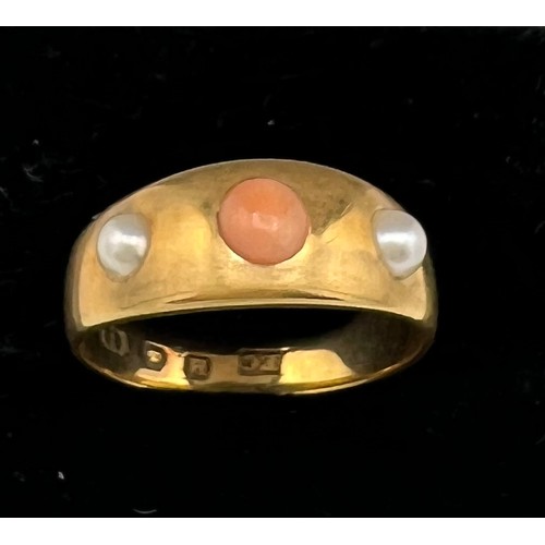 598 - An 18 carat gold ring set with coral and seed pearls. Size K. Weight 4.1gm.