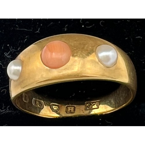 598 - An 18 carat gold ring set with coral and seed pearls. Size K. Weight 4.1gm.