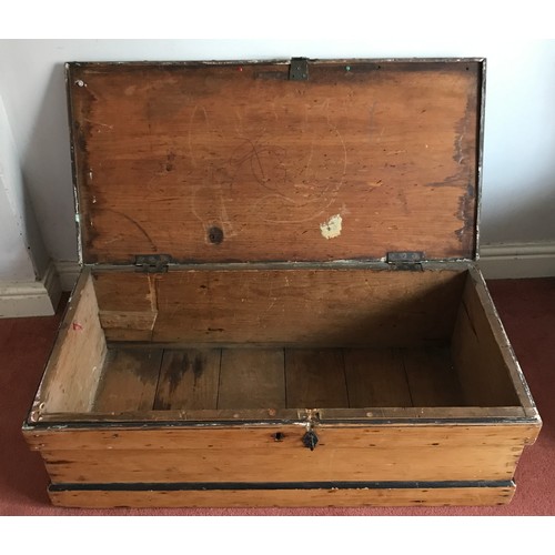 995 - A pine box with metal handles at either side and a metal lock to front. 97 w x 48 d x 31cm h.