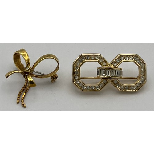 603 - A nine carat gold brooch in the form of a bow set with single diamond and a vintage Christian Dior c... 