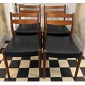 Four mid century teak dining chairs. Height 77cm to back.