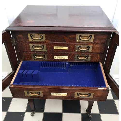 15 - Oak army & navy C.S.L. campaign flatware chest of four inlaid drawers on removable legs with wheels.... 