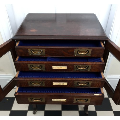 15 - Oak army & navy C.S.L. campaign flatware chest of four inlaid drawers on removable legs with wheels.... 