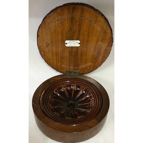 1259 - A circular footstool enclosing brown glazed spittoon marked T. Simpson & Sons Cabinet makers 13 h x ... 