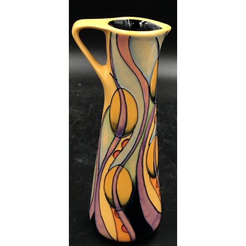 389 - A Moorcroft Pottery Jug, painted in the 'Swansong' pattern designed by Nicola Slaney, No 38. 19cm h.