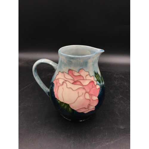 390 - A Moorcroft Pottery Collectors Club Jug decorated with pink roses 14.5cm h.