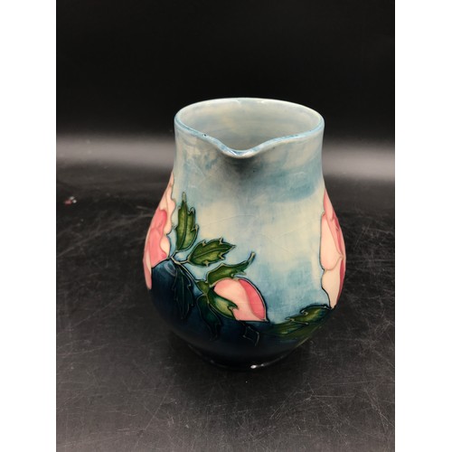 390 - A Moorcroft Pottery Collectors Club Jug decorated with pink roses 14.5cm h.