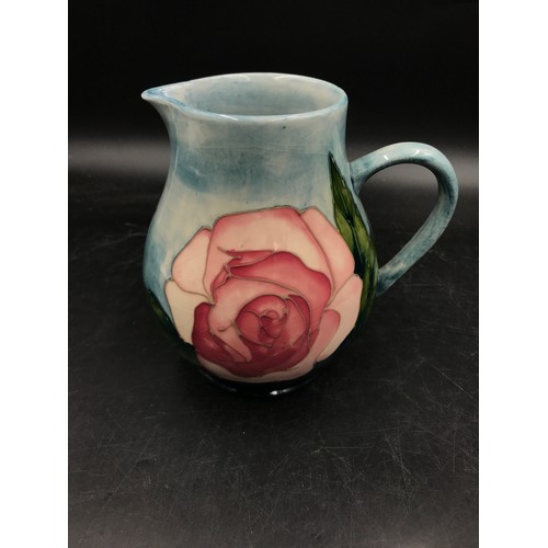 390 - A Moorcroft Pottery Collectors Club Jug decorated with pink roses 14.5cm h.