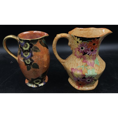 393 - Two Maling jugs one pastel with flowers pattern no. 6122 the other a lustre with star flower pattern... 