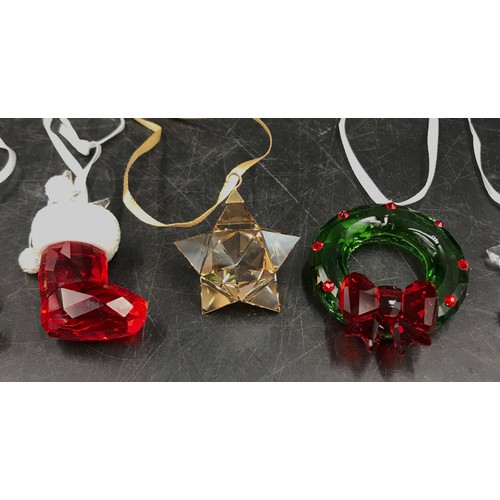 434 - Seven Swarovski glass Christmas tree ornaments to include: candy cane, Christmas tree, stocking, sta... 