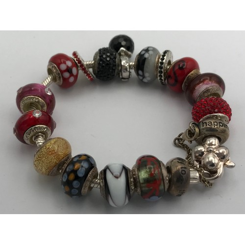 457 - A selection of five bracelets to include two Nomination bracelets, a Pandora bracelet with 3 spare c... 