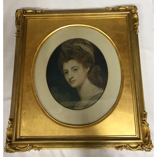 1603 - A painting of a lady in a large ornate frame. Medium unknown. Image 29cm x 24cm. Frame 56cm x 51cm.