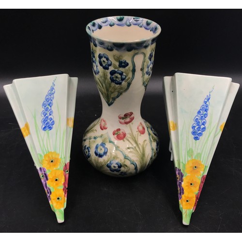 376 - A William Moorcroft Macintyre Burslem vase with floral design 21 h and a pair of hand painted hollow... 