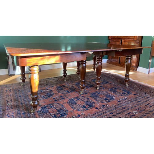 34 - A 19thC mahogany extending dining table with three leaves. 205 (with leaves) 156 (without leaves) x ... 