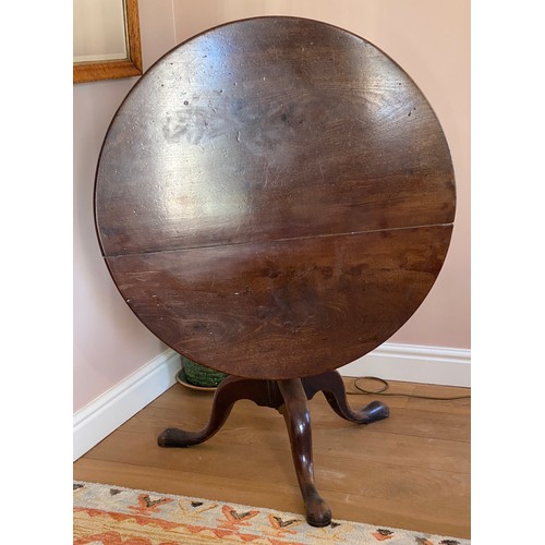 40 - A 19thC mahogany tilt top circular table on tripod base.