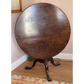 A 19thC mahogany tilt top circular table on tripod base.