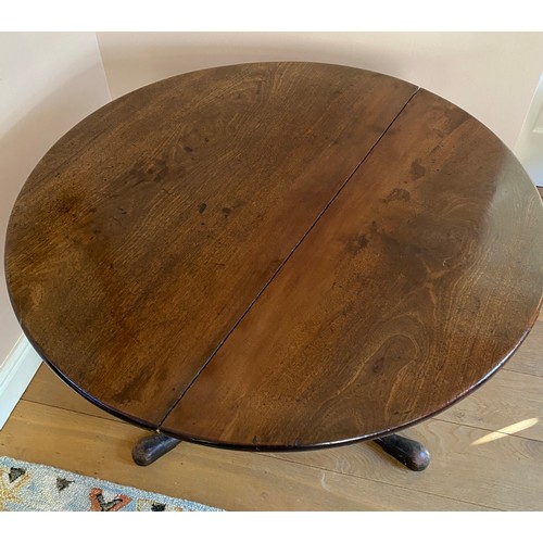 40 - A 19thC mahogany tilt top circular table on tripod base.