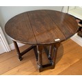 An oak drop leaf side table 71 x 62.5 x 54cm h when extended.
