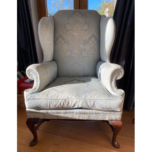46 - A 20thC wing back armchair 117 h x 82cm w.