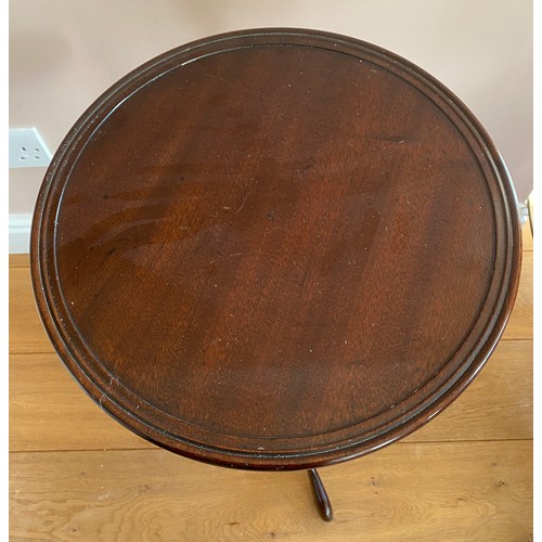 50 - A mahogany wine table on tripod base 38 d x 64cm h.
