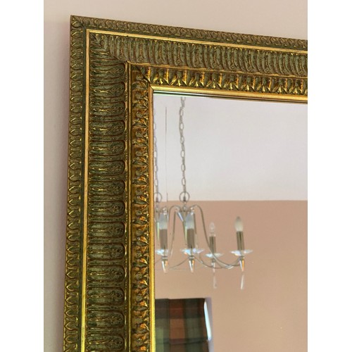 1149 - A large decretive bevel edged gilt framed mirror 105 h x 134cm w.