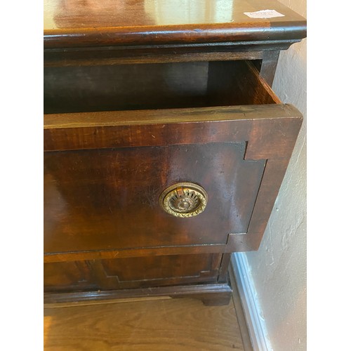 31 - A 19thC mahogany cabinet single drawer over two cupboards.