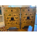 A pair of lacquered bedside cabinets in chinoiserie style 40 w x 32 d 60cm h.