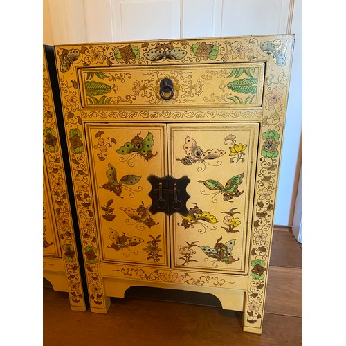 32 - A pair of lacquered bedside cabinets in chinoiserie style 40 w x 32 d 60cm h.