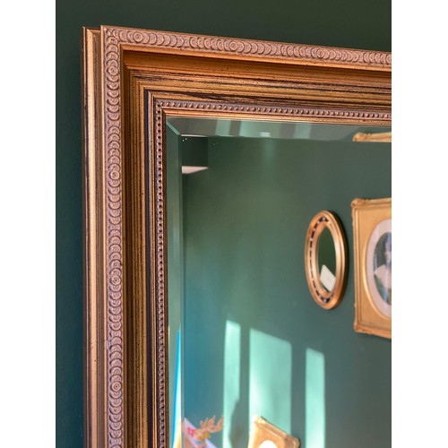 1151 - A 20thC gilt framed bevel edged mirror 70 h x 101cm w.